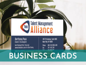 Image of business card in a holder with a plant behind with Business Cards written in white on a teal overlay