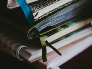stack of notebooks to demonstrate writing services