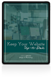 Image of tablet with Keep Your Website Up to Date text on top of computer image