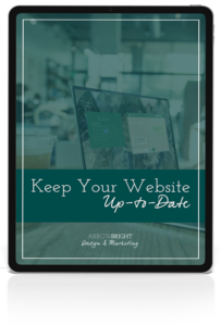 Image of tablet with Keep Your Website Up to Date text on top of computer image